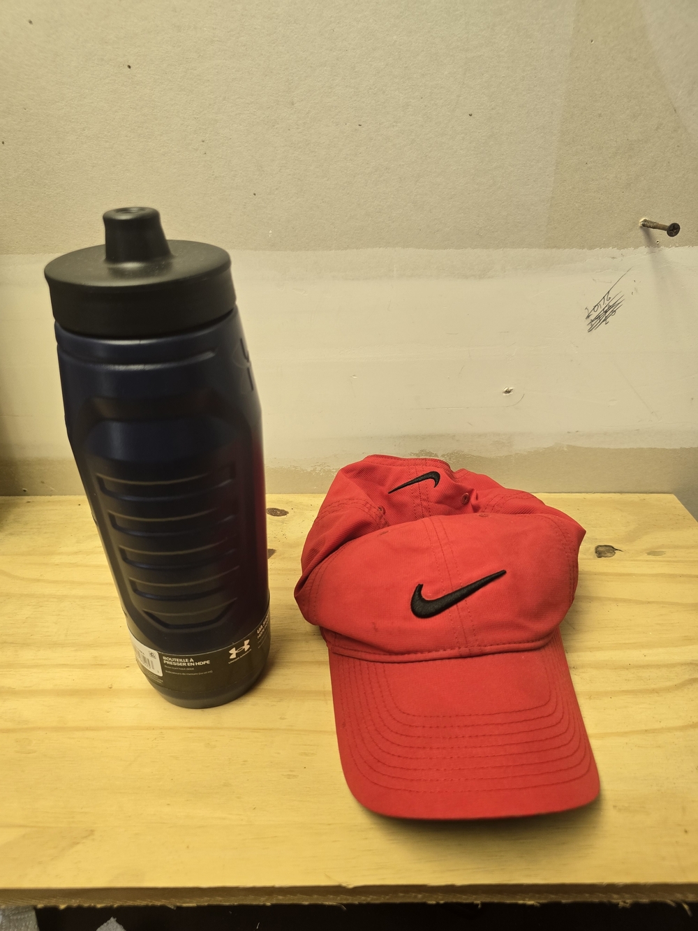 Red Nike Swoosh Cap And Water Bottle
